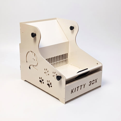 Kitty Box metal kedi tuvaleti, krem beyaz, önden çapraz görünüm, döner elek ve KITTY BOX yazılı atık çekmecesi